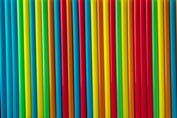 Colorful corrugated plastic arrange in row as background