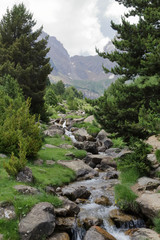 The Piedrafita de Jaca lake and Barranco Cuasta river with the Pena Telera massif in the aragonese...