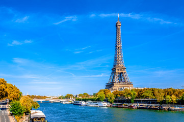 Panoramic view of Paris with the Eiffel tower and the River Seine in a sunny day at autumn.
