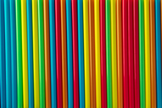 Colorful corrugated plastic arrange in row as background