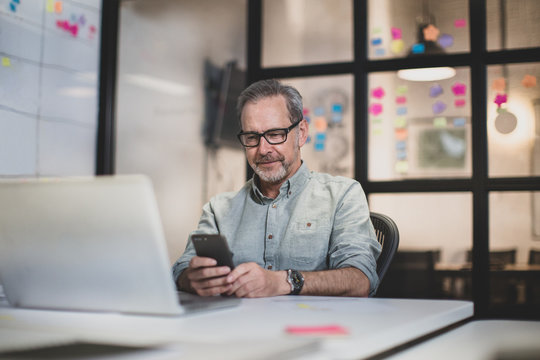 Mature male working late in an office