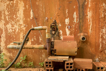 Abandoned Rusty Water Turbine Generator - Moldy Peeled Concrete Wall Texture/ Vintage Garden/ Countryside