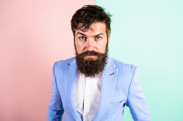 Barber tips grooming beard. Man bearded hipster on strict face pink blue background. Hipster guy...