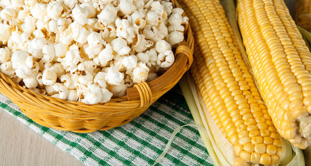 still life of basket with popcorn and fresh fruits of maize