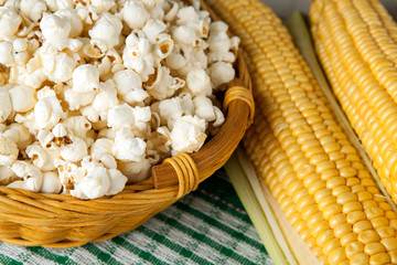 still life of basket with popcorn and fresh fruits of maize