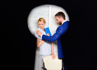 View through keyhole. Worker lady suspected in rights violation. Boss aggressive threatening....
