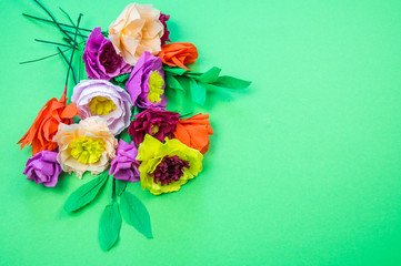 tools making crepe paper flowers green background