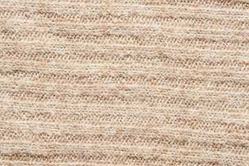 Texture of knitted fabric. Stranded threads. Cloth of warm winter clothes.