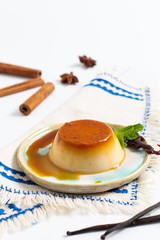 Food Dessert concept homemade vanilla Caramel custard or panna cotta with vanilla beans and spices on white background