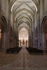 Fototapeta premium The main central nave, the dome and the baroque retable in the Veruela Cistercian abbey gothic church, in Aragon region, Spain