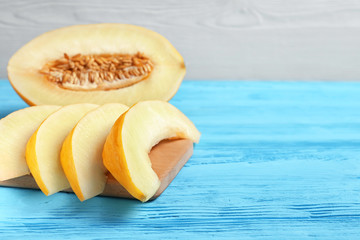 slices of melon on a blue table
