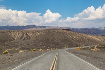 A road through a volcanic landscape in Death Valley, California