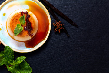 Food Dessert concept homemade vanilla Caramel custard or panna cotta with vanilla beans and spices...