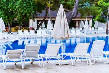 Loungers near the pool, rest in the hotel