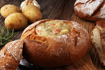 Homemade potato cream soup, served in bread bowl.