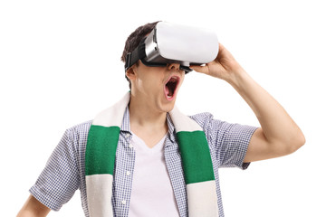 Excited young man using a VR headset