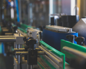 Conveyor for bottling and packing bottles in the factory.