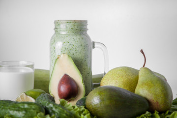  Still life of green vegetables and fruits. Smoothies.Milk.