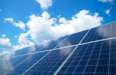 Blue solar panels over blue sky. Renewable energy.