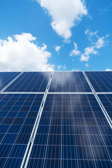 Obraz premium Blue solar panels over blue sky. Renewable energy.