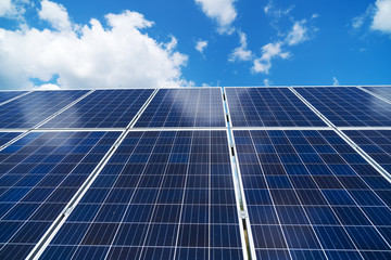 Blue solar panels over blue sky. Renewable energy.