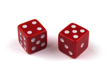 Two red dice closeup, isolated on white background, four and five