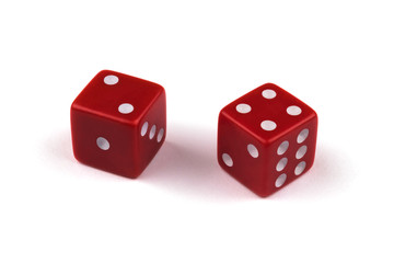Two red dice closeup, isolated on white background, two and four