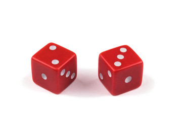 Two red dice closeup, isolated on white background, two and three