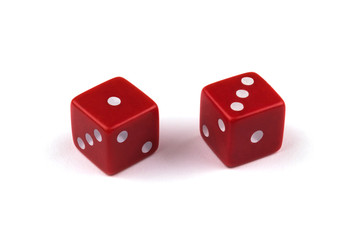Two red dice closeup, isolated on white background, one and three