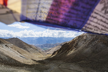Buddhist prayer flags blowing in the wind.