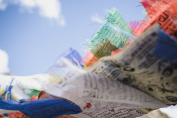 Buddhist prayer flags blowing in the wind.