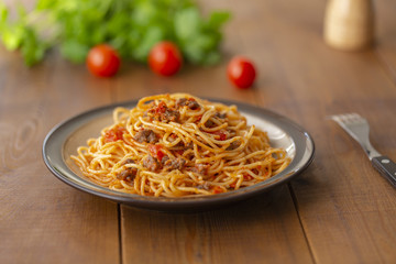 Spaghetti bolognese pasta with tomato sauce and minced meat. Homemade healthy italian pasta on wooden background