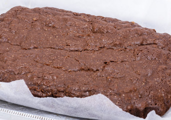 whole browned brownie pie on parchment paper