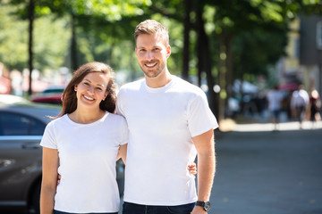 Happy Couple Standing On Street