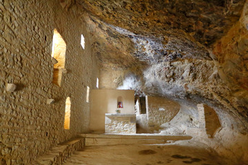 The internal altar of the Cavern Hermitage (Eremita de la Cueva), an old stone sanctuary built into...