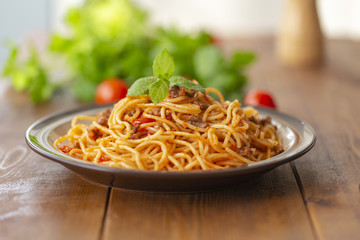 Spaghetti bolognese pasta with tomato sauce and minced meat. Homemade healthy italian pasta on wooden background