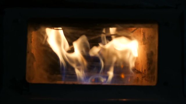 Vintage old gas fireplace in which fire burning close up view