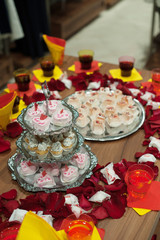 buffet table with snacks, cakes, drinks and champagne