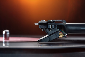 Tonearm with pickup head.