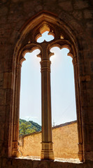 The Gothic pointed arch window with decorations at the entrance of the Saint Blaise church (Iglesia de San Blas) in the Anento small town, in Aragon province, Spain