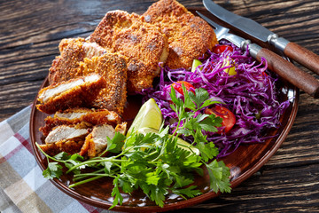 close up of breaded pork fillet, rustic style