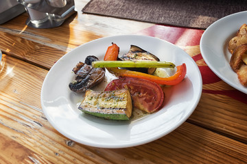 Grilled vegetables on a white plate