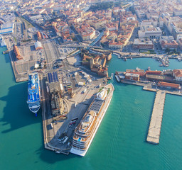 Large ocean liners are moored in the seaport of Livorno, Italy
