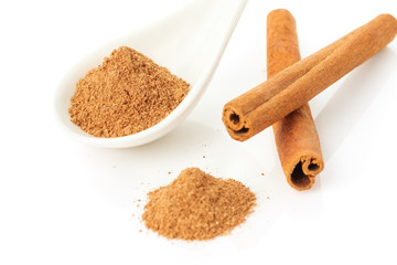 Cinnamon sticks and powder on white