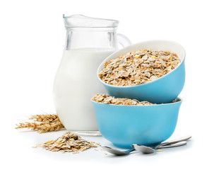 muesli in blue masks and milk jug isolated on white