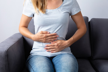 Woman Suffering From Stomach Pain