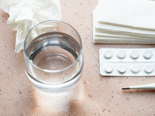 Fototapeta na wymiar glass of water and set of medical items