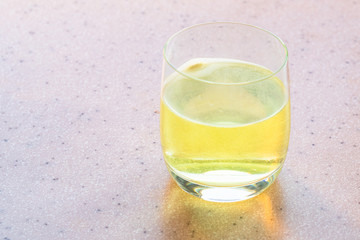 water with yellow effervescent tablet of vitamin