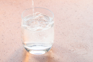mineral carbonated water fills a glass