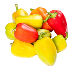 pile of fresh bell peppers cut out on white